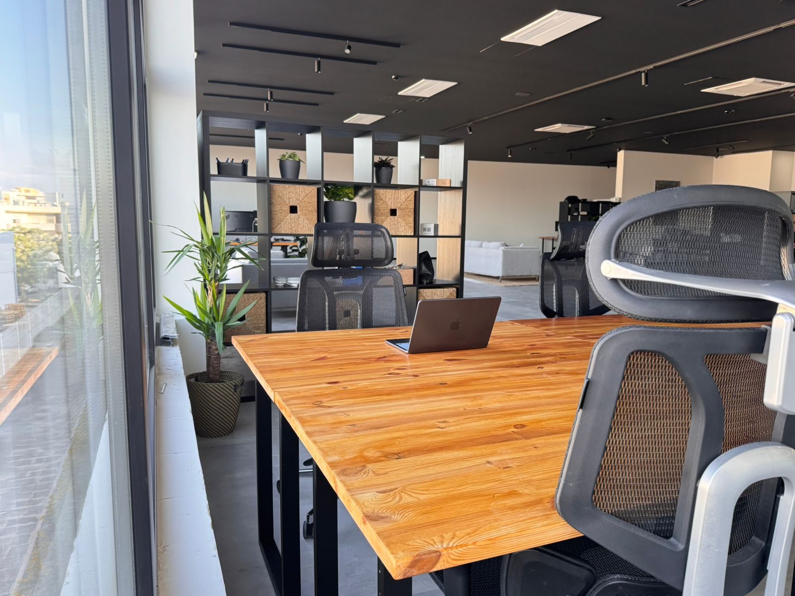 A dedicated desk by the window at 22cowork